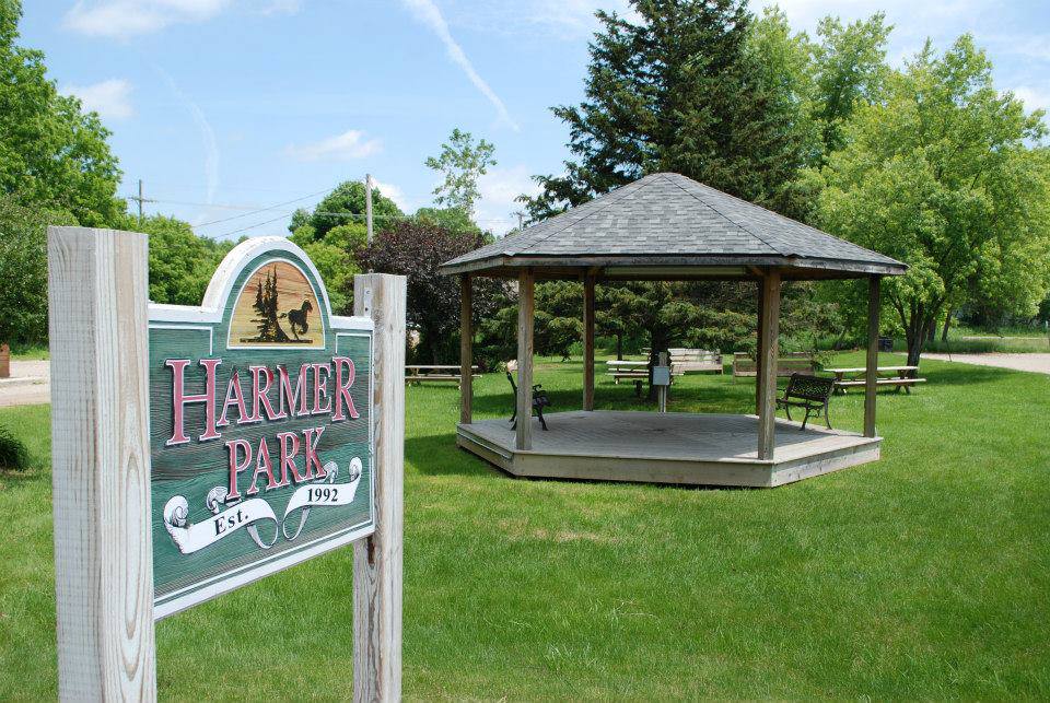 Harmer Park entrance sign and gazebo on sunny day